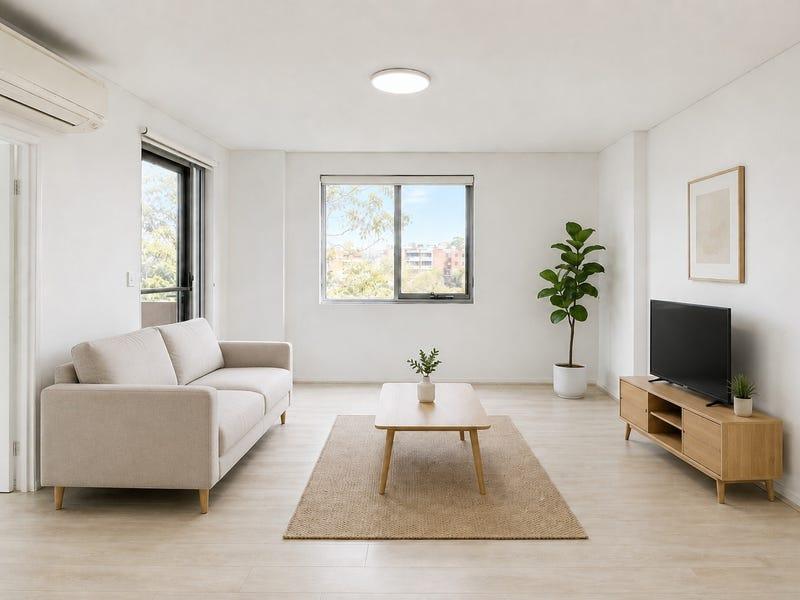 Minimalist living room with a neutral sofa, natural wood TV unit and uncluttered furniture layout